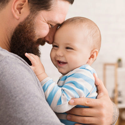 A loving father embracing baby, symbolizing the bond & clarity provided through Paternity DNA Genetic Testing by My Forever DNA. Accurate, fast, & confidential results ensure peace of mind & legally recognized answers.