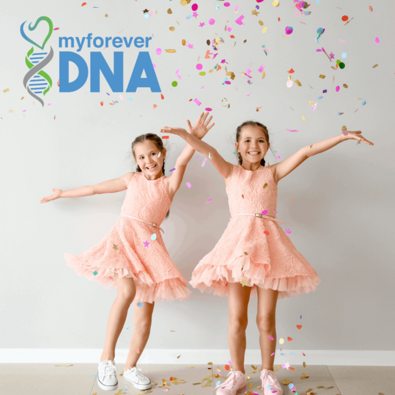 Joyful twin girls in matching pink dresses celebrating with confetti, representing Twin Zygosity DNA Genetic Testing from My Forever DNA in Omaha, NE.