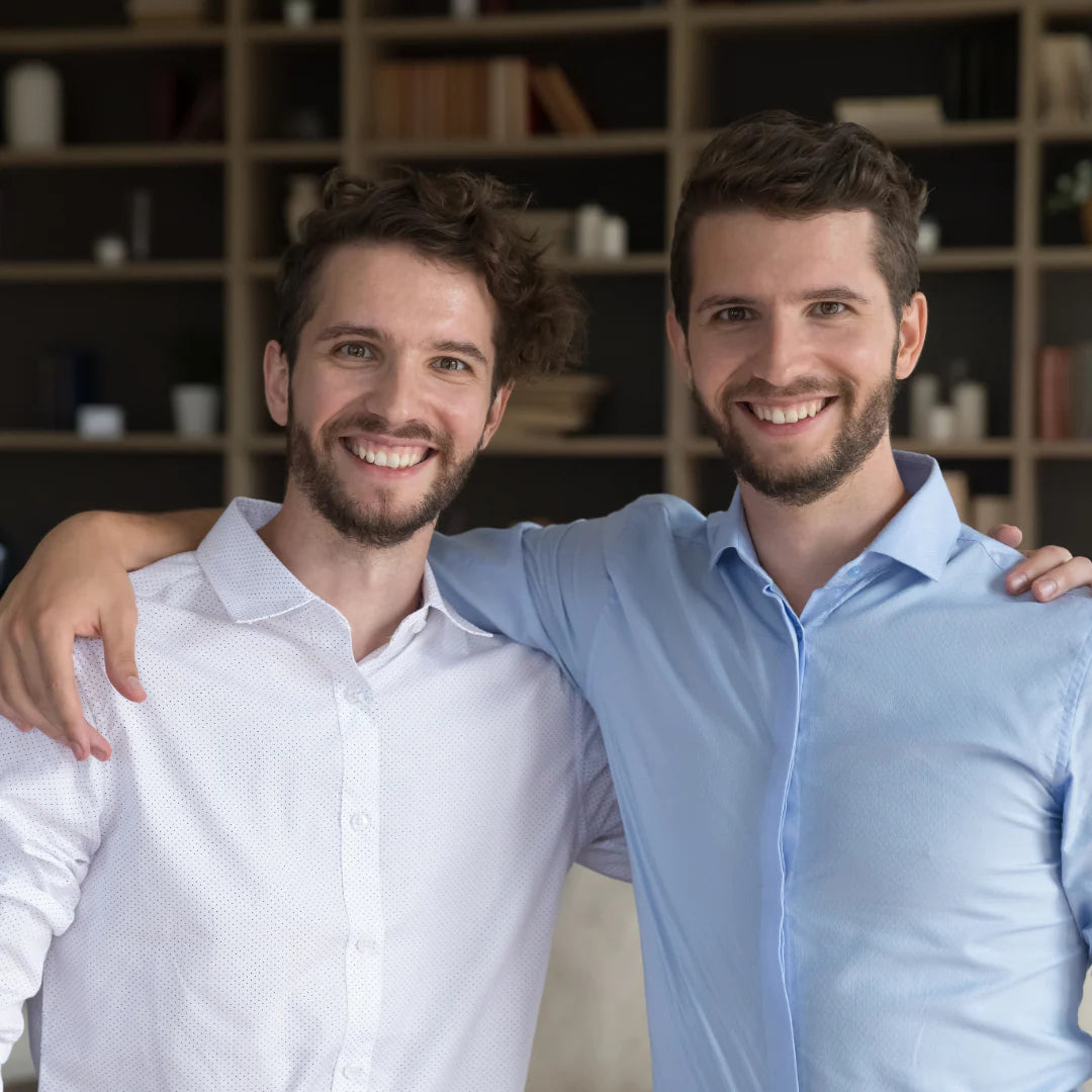 Smiling adult twin brothers, representing My Forever DNA’s Twin Zygosity DNA Test to determine if twins are identical or fraternal.