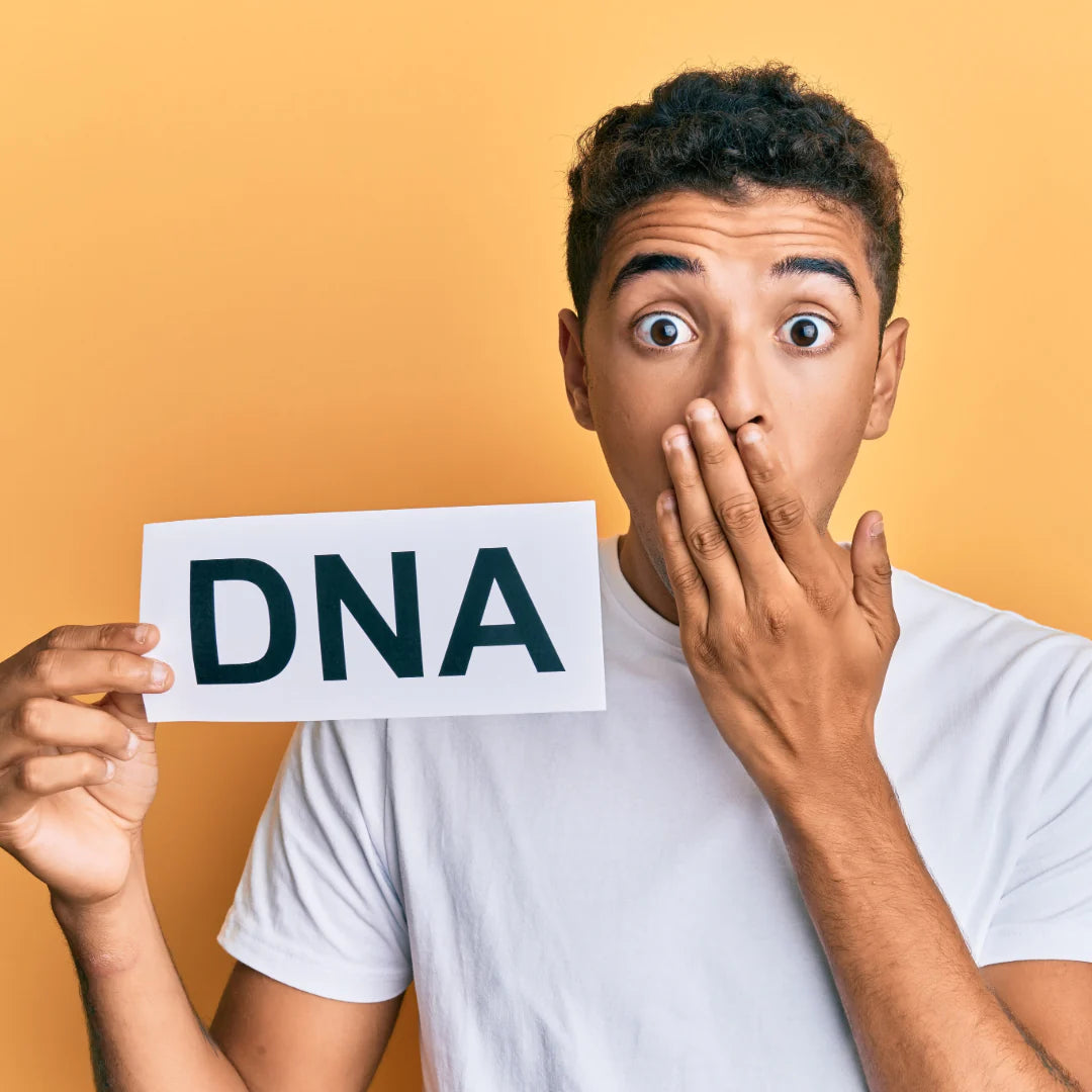 Surprised man holding DNA sign, representing unexpected results or emotional reactions from My Forever DNA home testing kits.