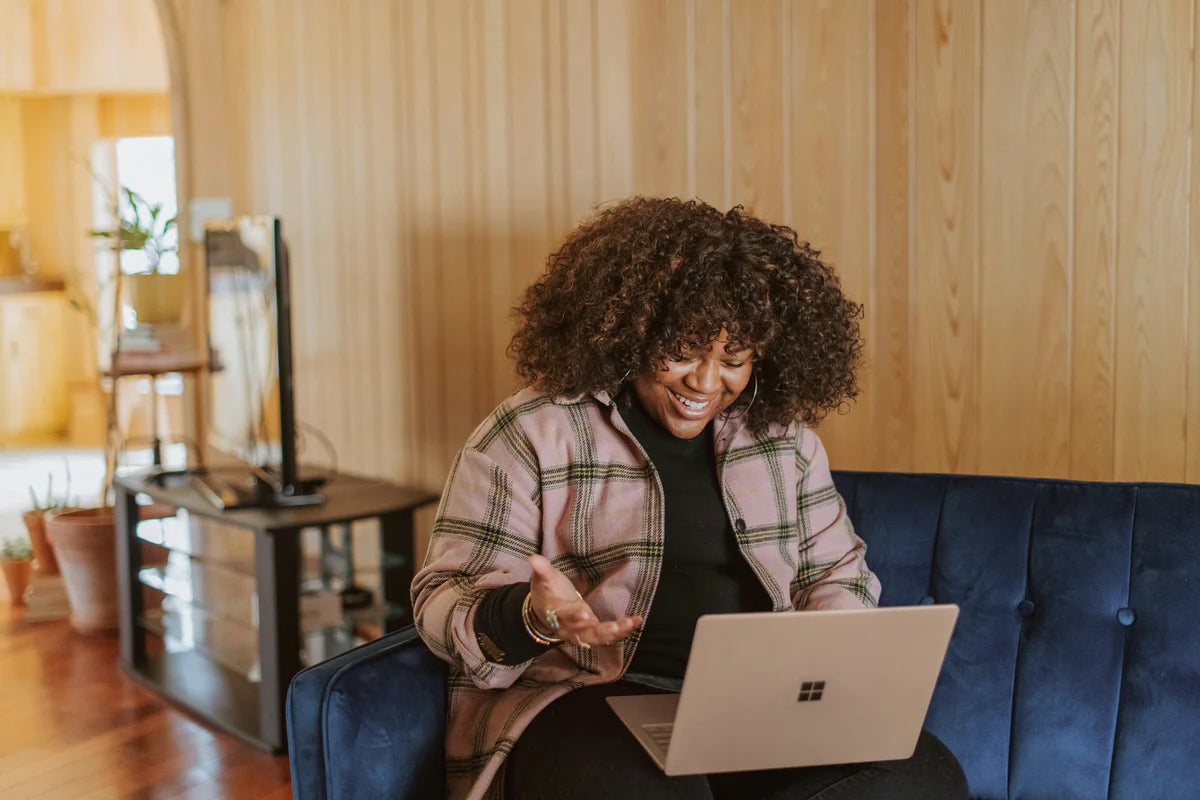 Happy woman viewing DNA results online from My Forever DNA's Multiple Location Home Test - fast, accurate results from different addresses.
