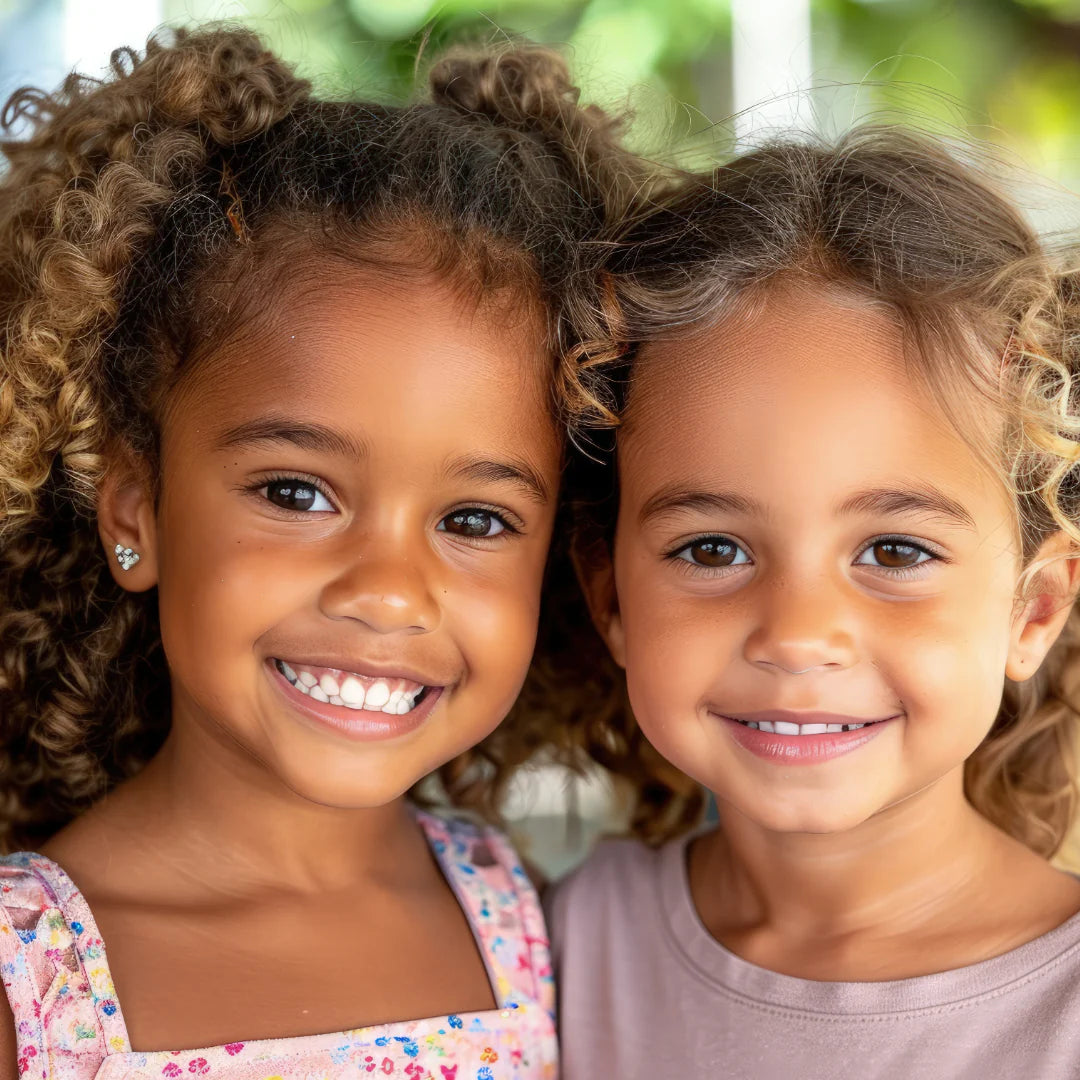 Happy twin girls representing My Forever DNA’s Twin Zygosity Test - accurate at-home testing to confirm identical or fraternal twins.