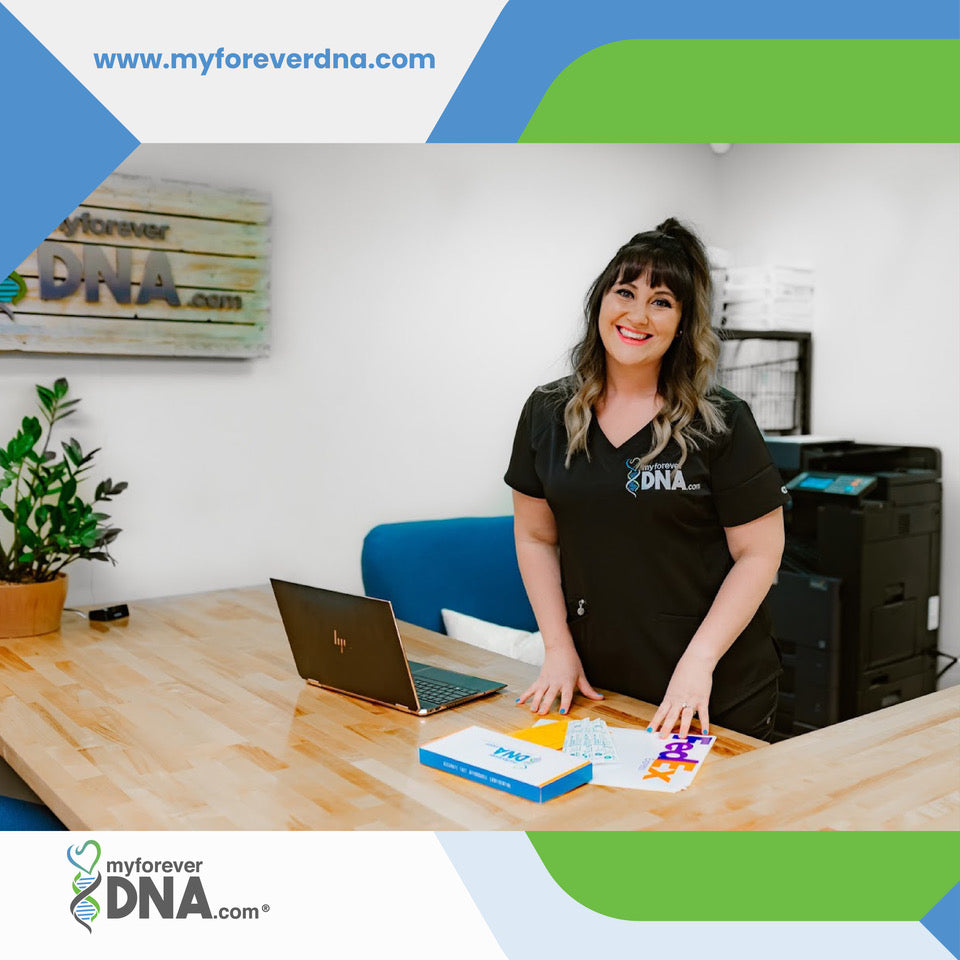 Woman in My Forever DNA uniform at desk with laptop and DNA test kit; company logo and website visible in background.