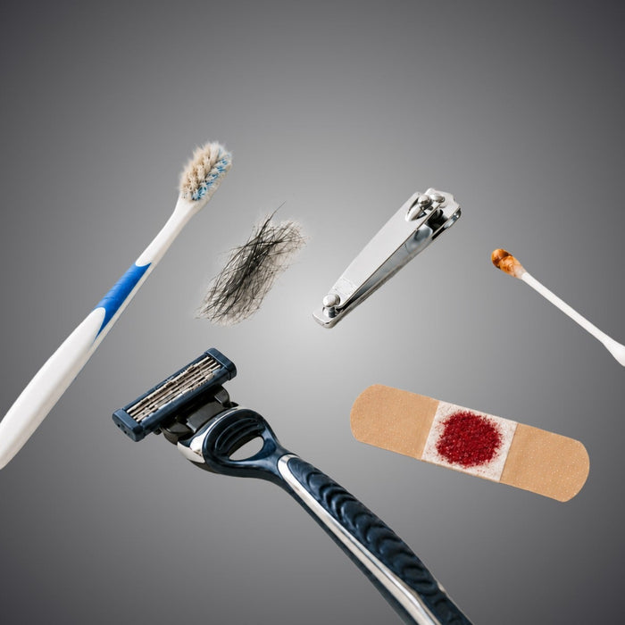 Discreet DNA testing samples including a toothbrush, hair, nail clippings, razor, cotton swab, and blood bandage.
