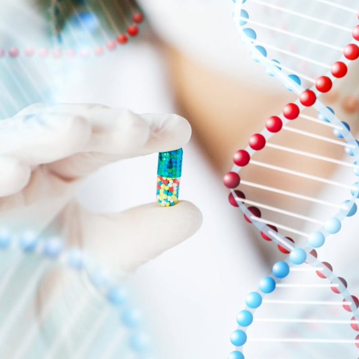 Scientist holding a DNA sample chip with digital DNA double helix strands in background - symbolizing advanced genetic testing.