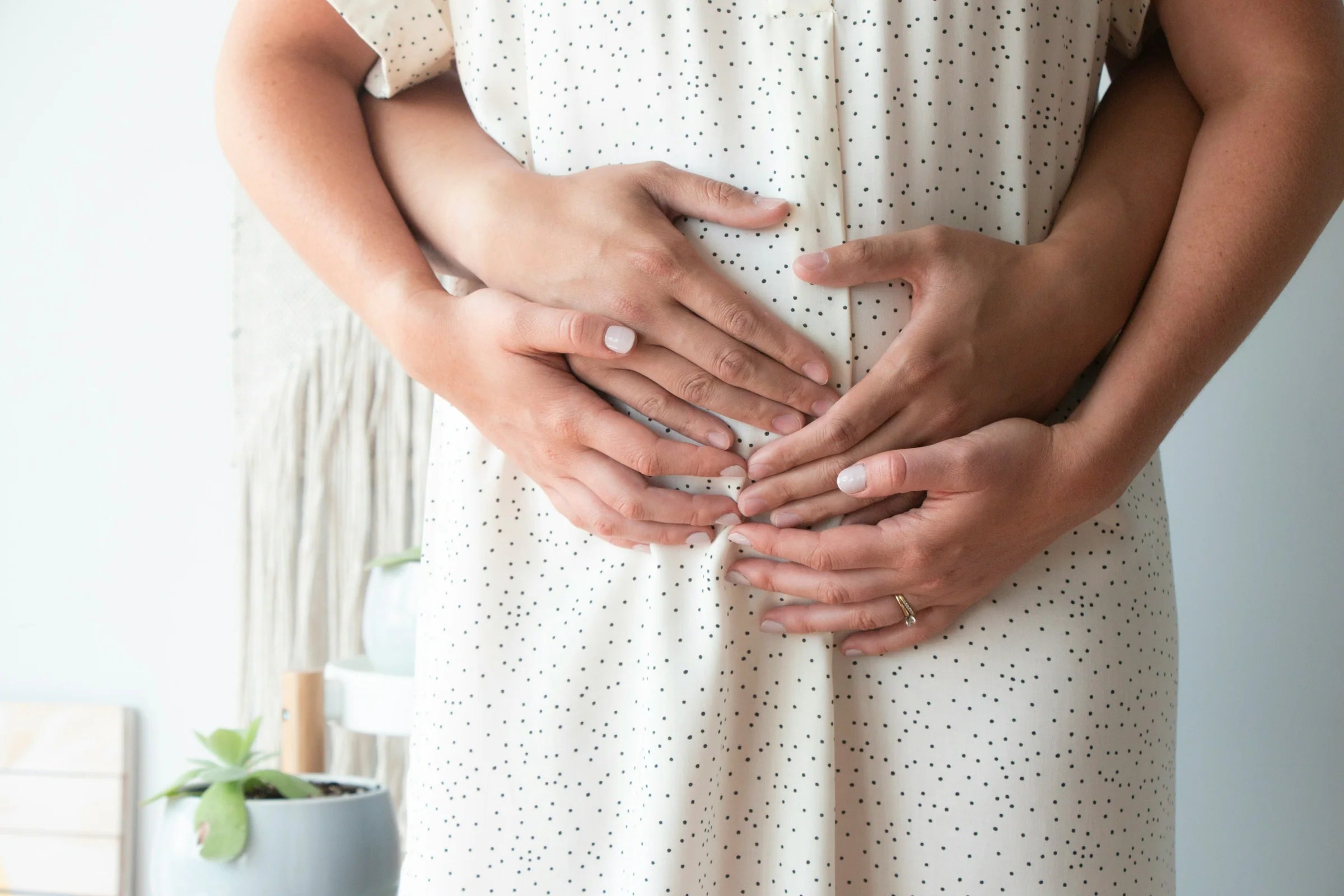 Couple embracing over baby bump, representing Prenatal Paternity DNA Test to confirm biological father before birth.