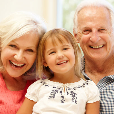 Accurate DNA testing by My Forever DNA - grandparents smiling with granddaughter representing trusted Grandparent DNA Test.