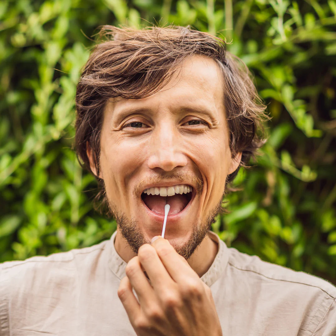 Man collecting cheek cell sample for My Forever DNA’s DIY Home DNA Test- quick, accurate, and easy genetic testing at home.